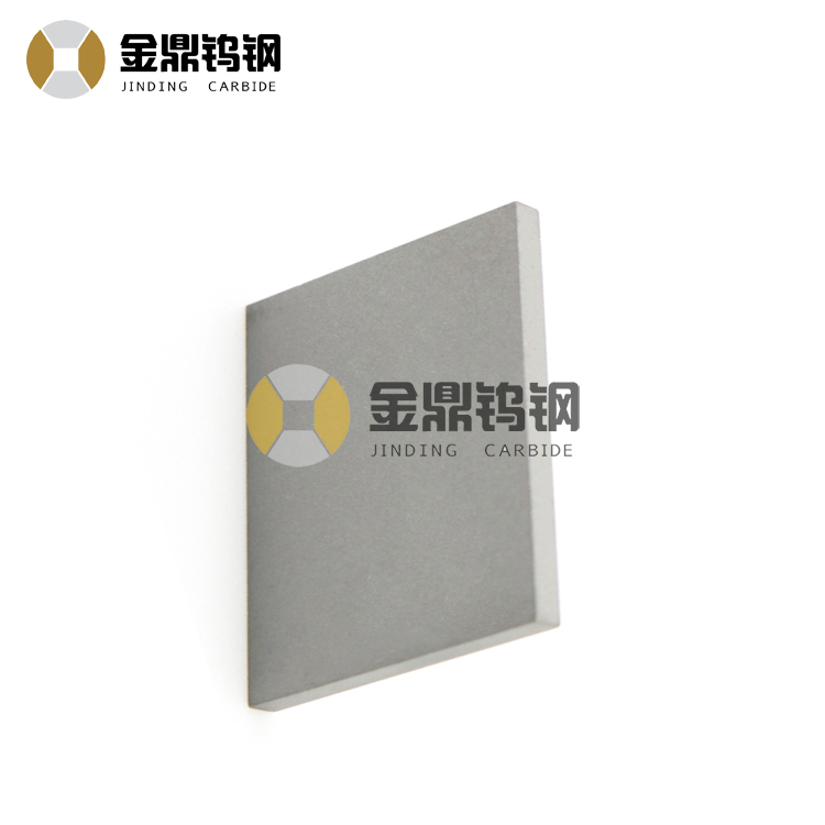 Sintered cemented tungsten carbide plate for railway tamping tools